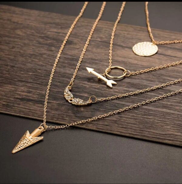 stylish golden colored ladies necklace with 3 layered chains and 3 different pendants - Image 3