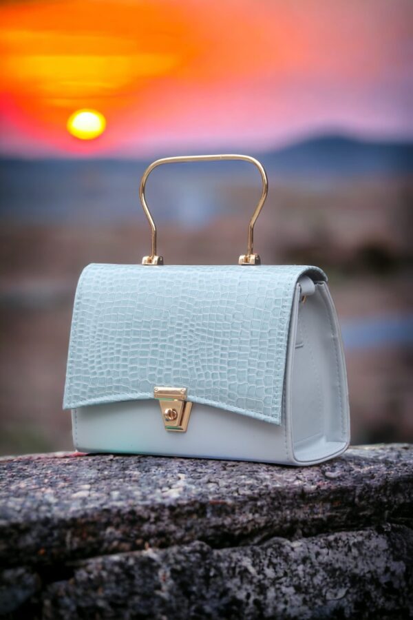 stylish hand bag with top handle and long strap